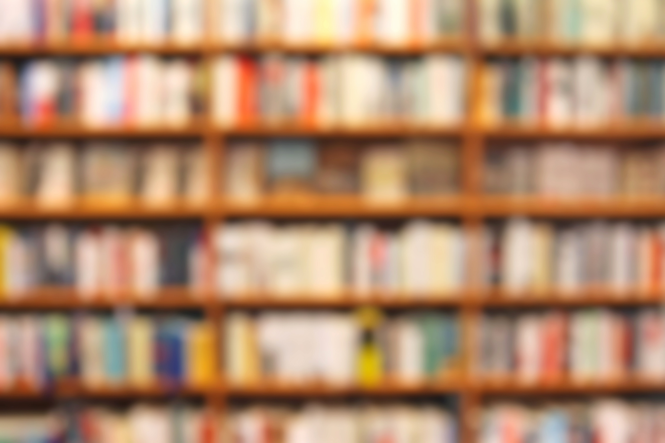 Defocused bookstore background, shelves with books